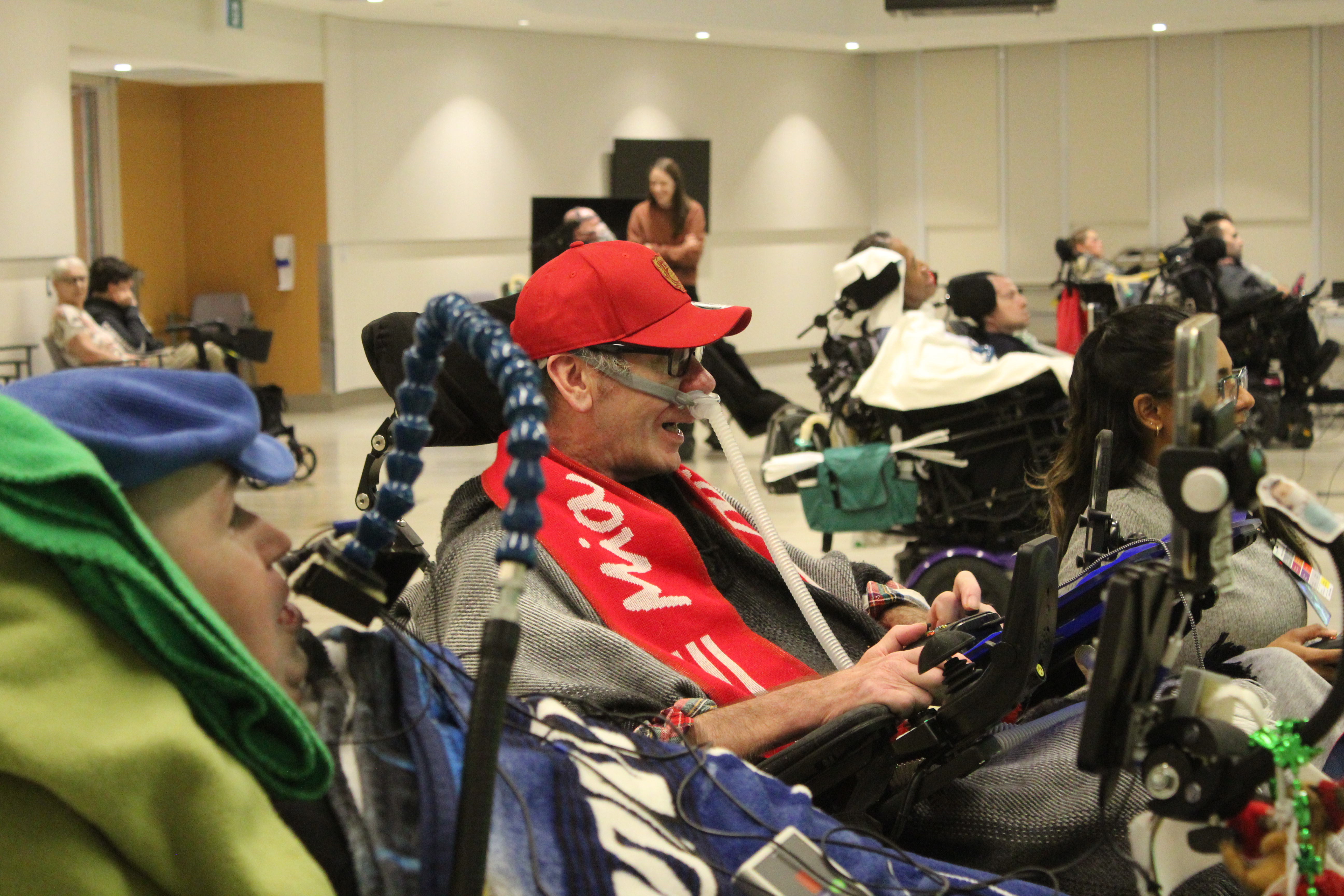 Karl (centre) plays FIFA 2023 against Nic (left).